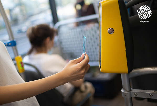 Image of person tapping his card on the bus