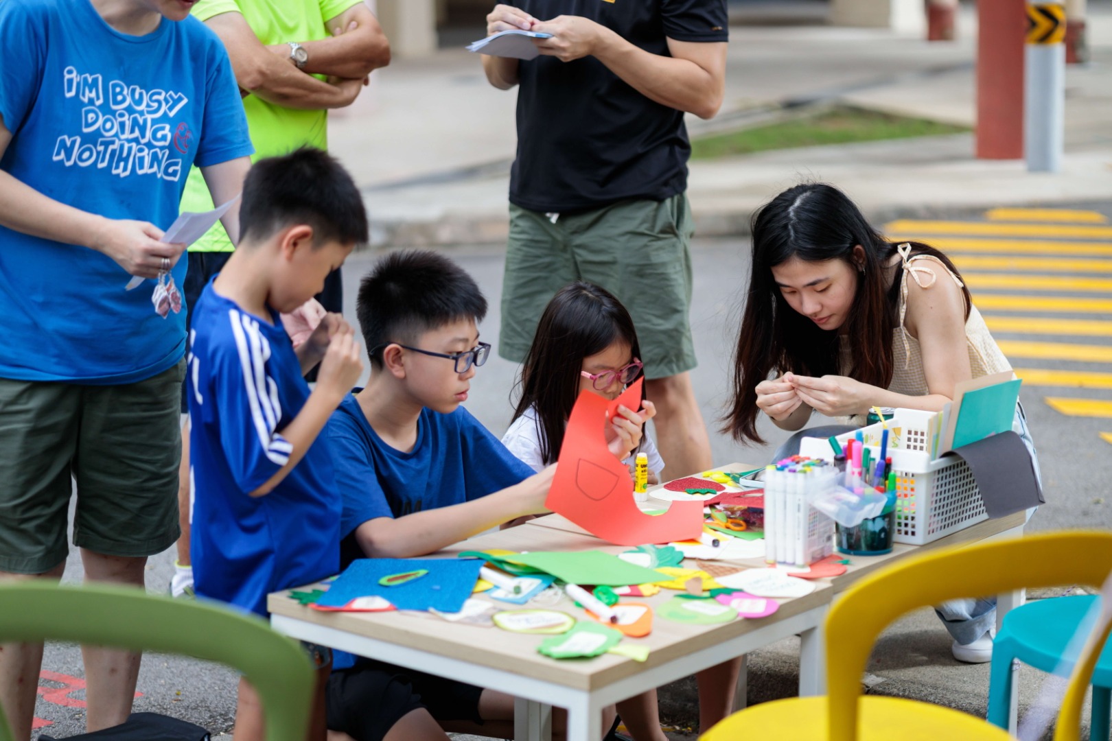 A group of children engaging in an activity at one of the parklets at the Parking Day 2023.