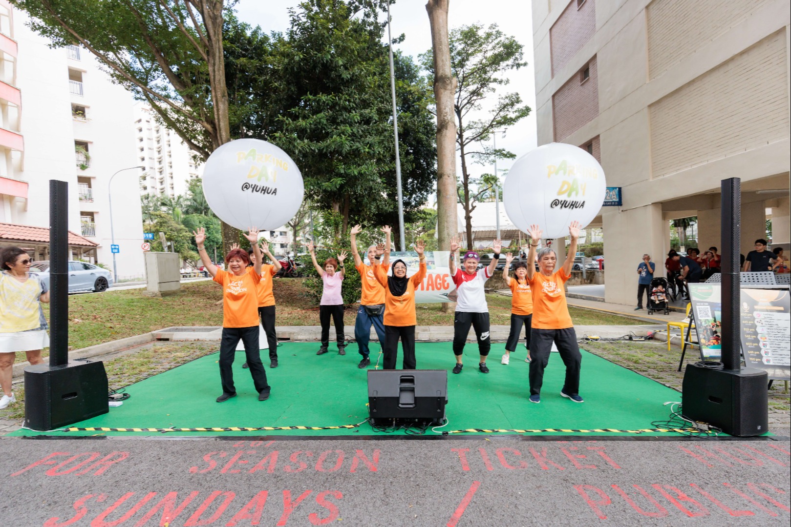 A group of senior citizens showcasing fitness routine at the Parking Day 2023